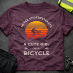 Never underestimate a cute girl on a bicycle T-Shirt